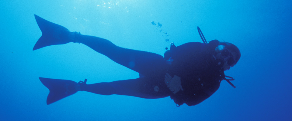 a person underwater wearing scuba gear