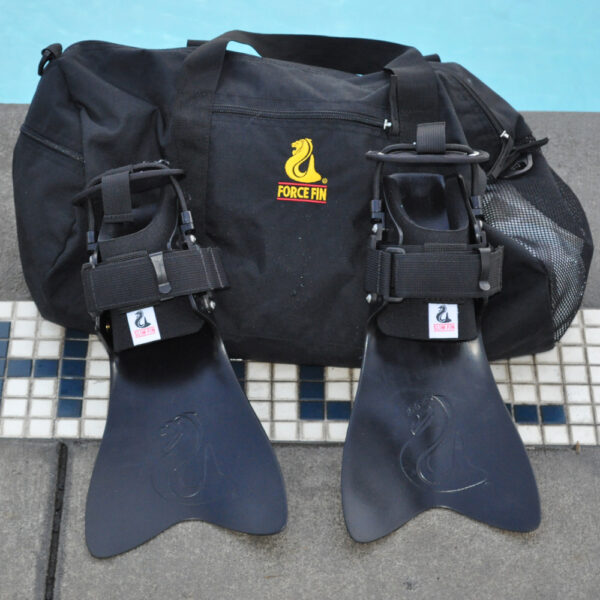 a pair of swim fins and a duffel bag